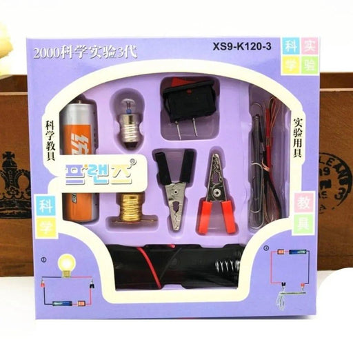 Science experiment kit packaging with various tools on a wooden surface