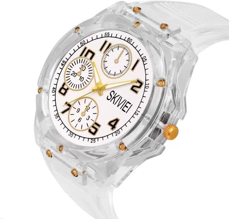 Clear wristwatch with gold accents and a white face displaying the brand 'SKVVIE'.
