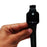 Black smartwatch with Apple logo held in a hand against a white background
