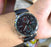 Current watch on a wrist with a blurred background