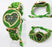 Green heart-shaped watch with green bracelet on a white background