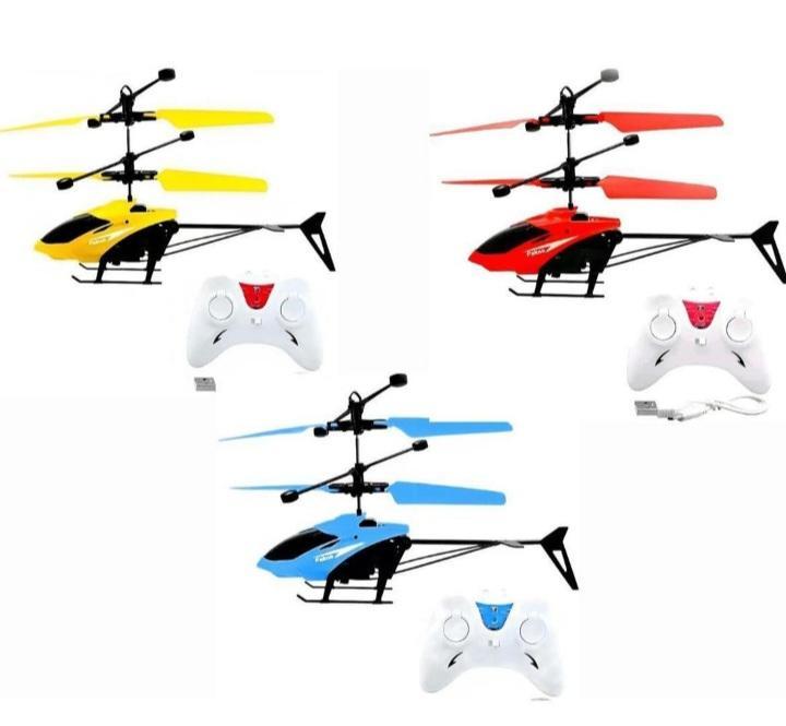 Four colorful RC helicopters with remote controls on a white background