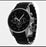 Black wristwatch with a detailed face on a white background