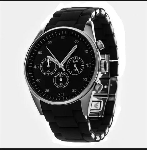 Black wristwatch with a detailed face on a white background