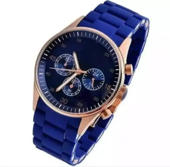 Blue watch with rose gold accents on a white background