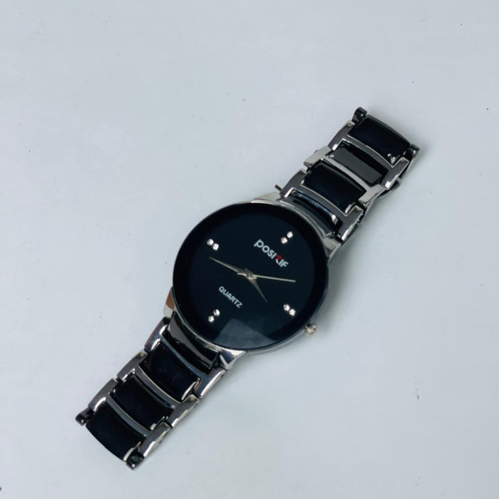 Black watch with a metal strap on a white background