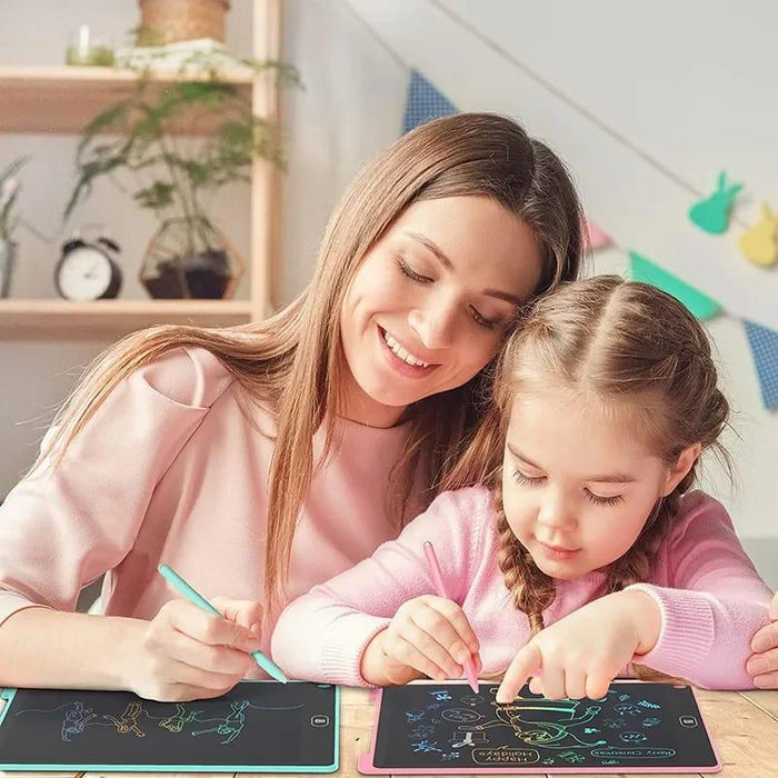 Woman and young girl using a digital drawing tablet together.