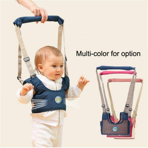 Baby in a blue walking harness with additional harnesses shown in the background.