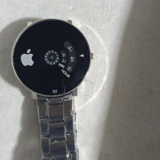 Smartwatch with a metallic band on a white surface