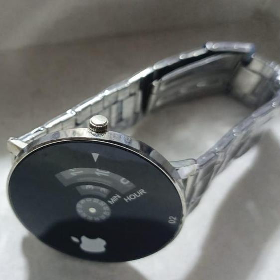 Smartwatch with a black screen displaying a signal icon on a light gray background