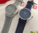 Two watches with star-patterned straps on a white background