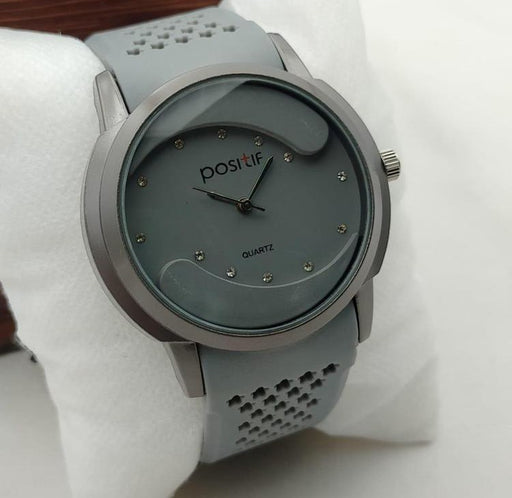 Gray wristwatch with 'positif' brand on a white background