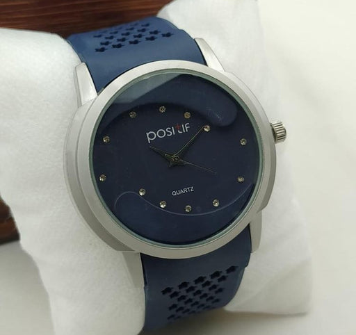 Blue watch with silver case on a white background