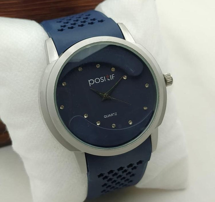 Blue watch with silver case on a white background