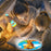 Woman and child reading a book with a glowing flashlight and cartoon giraffe illustration.
