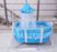 Blue baby crib with canopy in a home setting