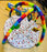 Colorful baby gym with toys on a patterned mat