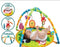 Baby play gym with hanging toys and soft padding, featuring a baby lying on it.